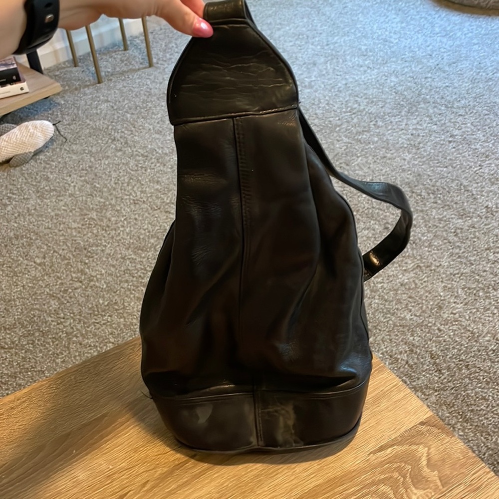 Perlina black leather sling backpack